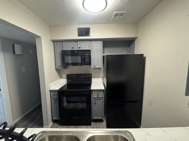 Updated model kitchen at Terraces at 2602 in Texas City