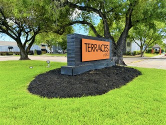 Terraces at 2602 monument sign during the day