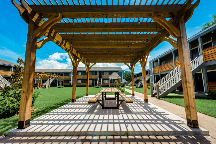 Community pergola and lawn area at Terraces at 2602 in Texas City